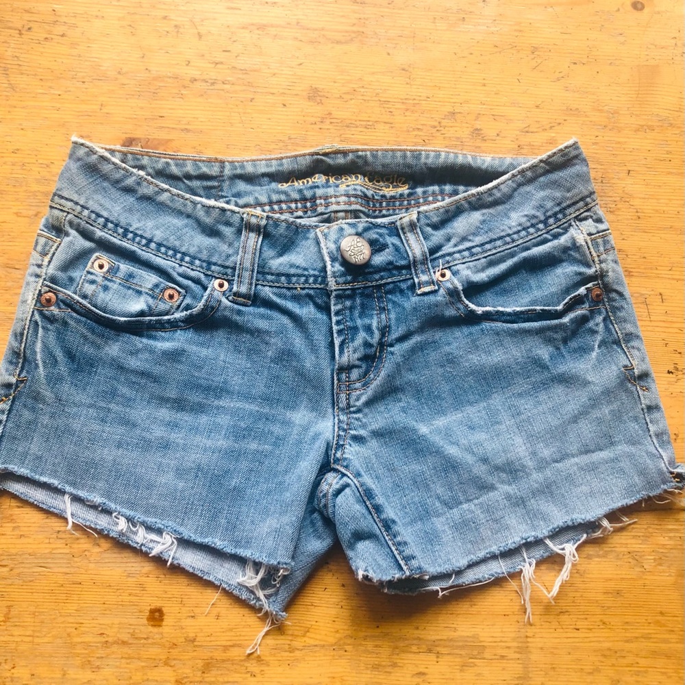 American Eagle cutoffs, size 0. Low rise; well worn and comfy but no holes.